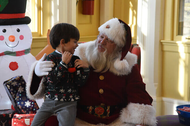Child sitting on Santa's lap