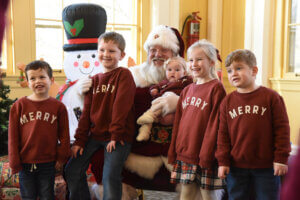 Family taking photo with Santa