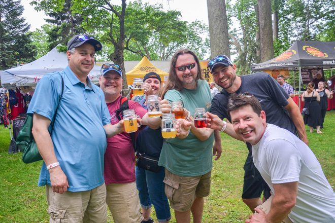 people posing with beer glasses