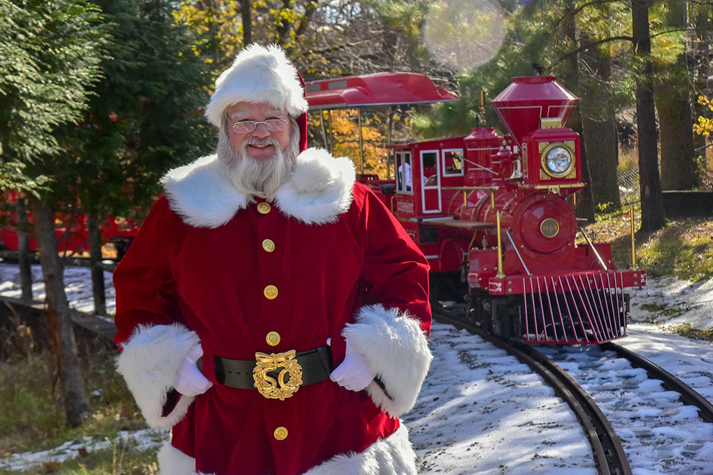 santa in front of train