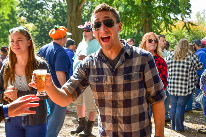 man being handed a freshly poured beer