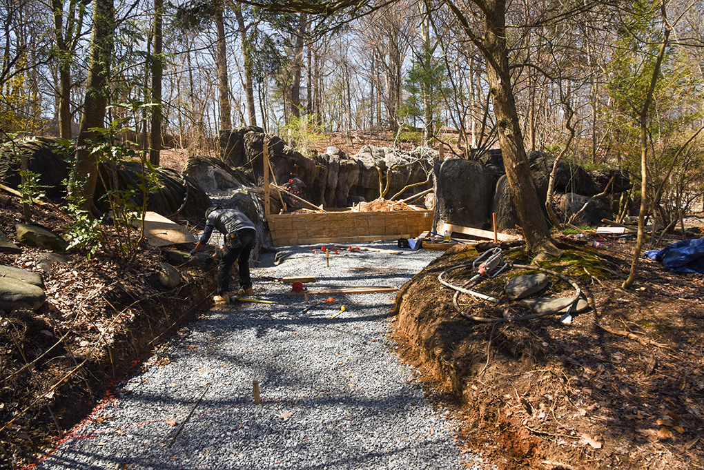 Otter habitat path construction, lined with stone.