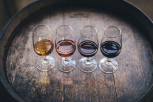 wine glasses on a barrel.