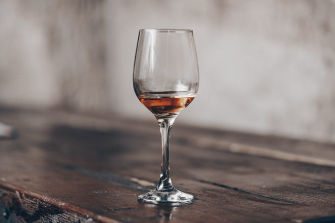 glass of wine on table.