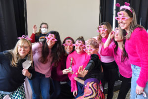 group of women with flamingo sunglasses