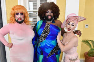 three drag queens in dresses