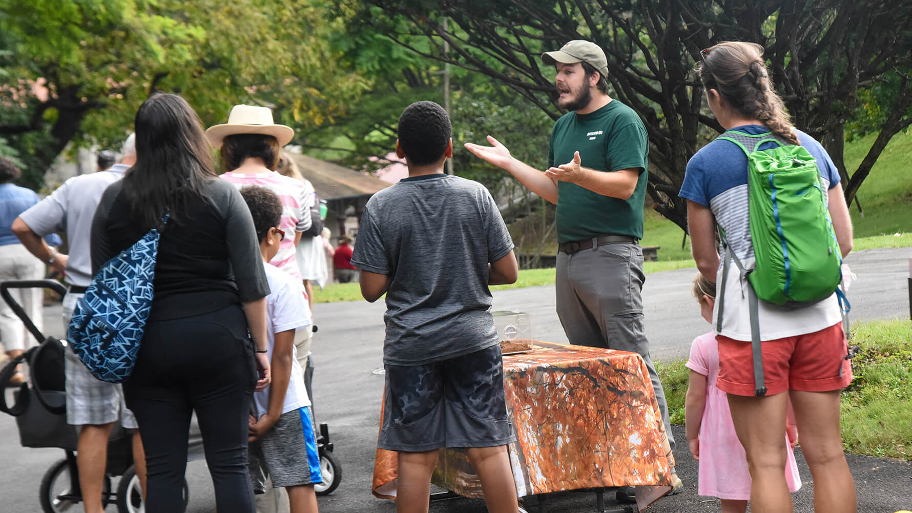 educator speaking with guests