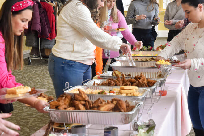 guests getting food from buffet