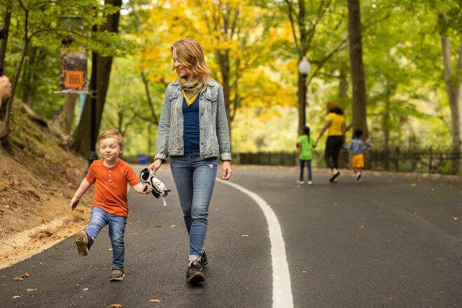 woman walking with child