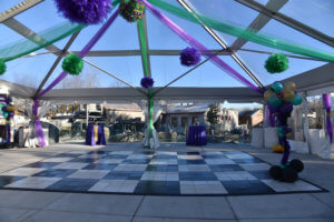 inside large tent set up next to penguin coast exhibit