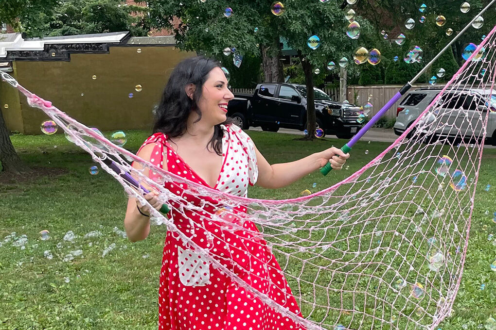 Woman with large bubble wand