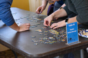 Puzzle Palooza guests working on puzzle