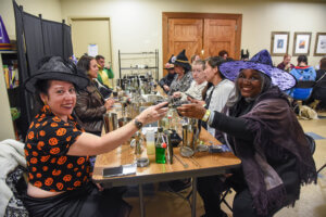 Mixology guests in Halloween costumes during the class